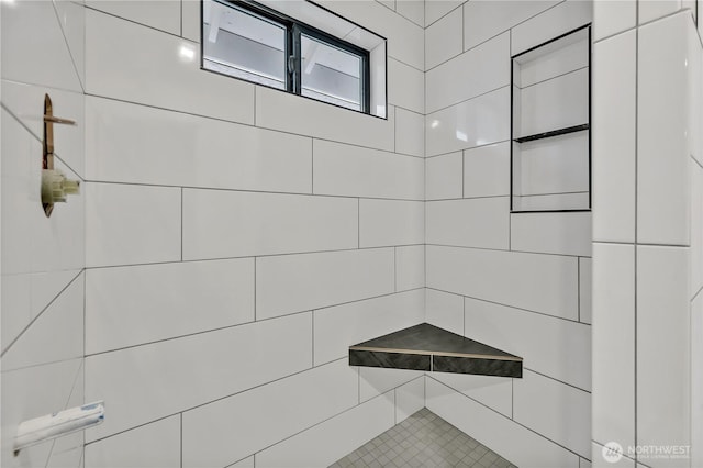 full bathroom with tiled shower