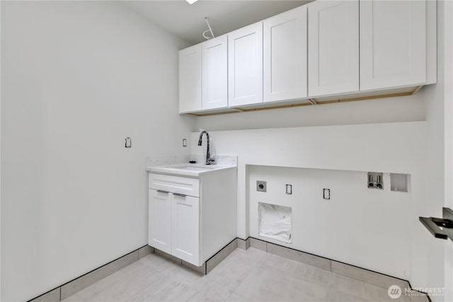 washroom with light tile patterned flooring, cabinet space, electric dryer hookup, washer hookup, and a sink