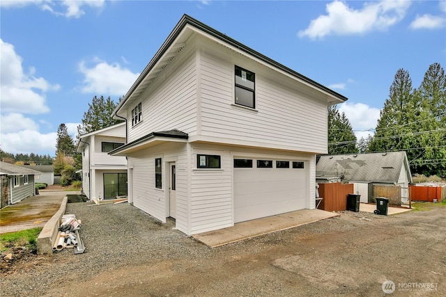 view of home's exterior featuring fence