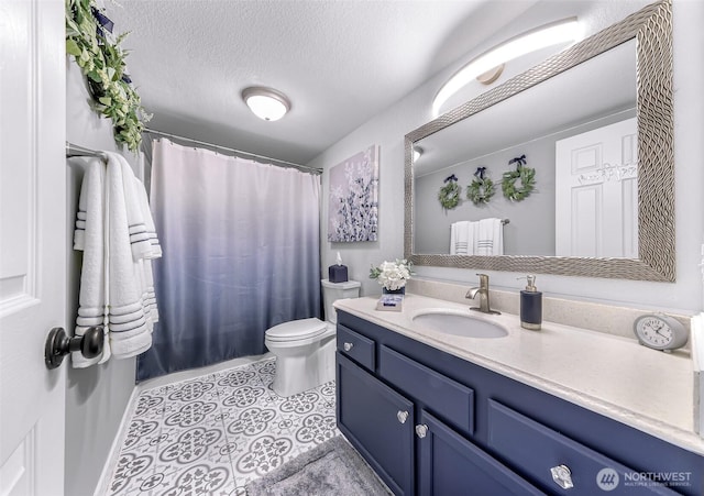 bathroom with vanity, a shower with shower curtain, a textured ceiling, tile patterned floors, and toilet