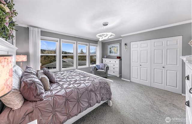 carpeted bedroom featuring crown molding, baseboards, and a closet