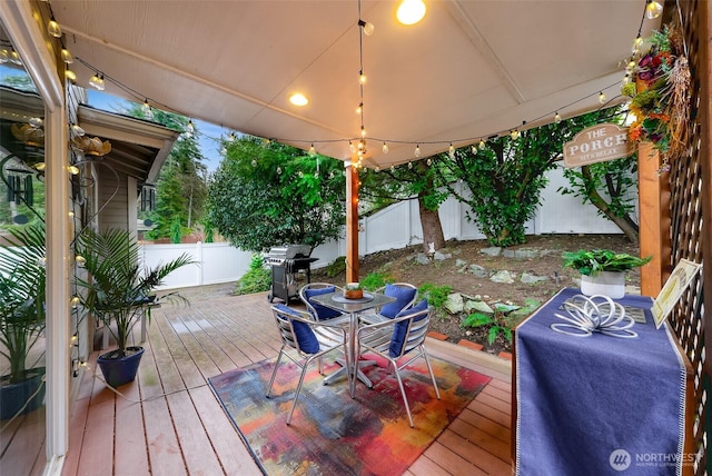 deck featuring area for grilling and a fenced backyard