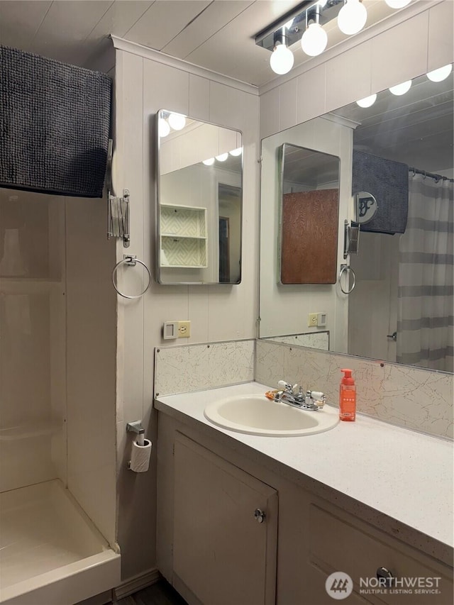 full bath featuring a shower stall and vanity