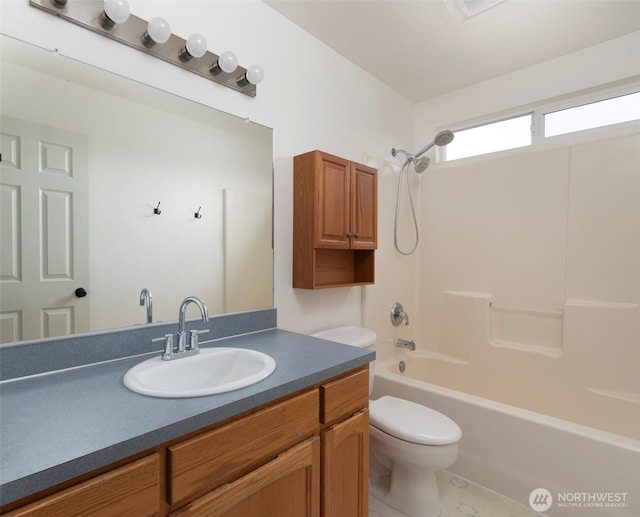 full bath with vanity, shower / tub combination, and toilet