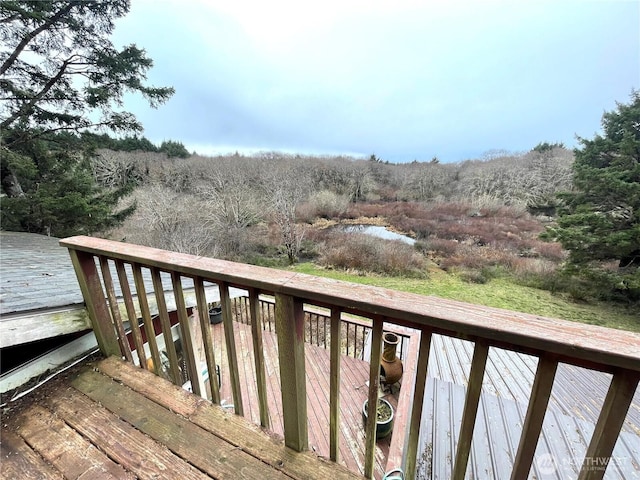 deck featuring a wooded view