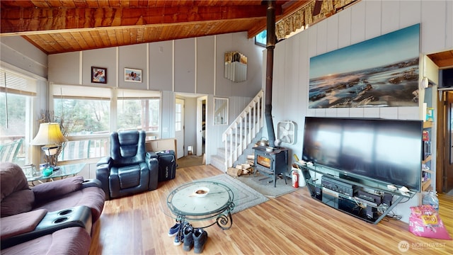 living area featuring stairway, wooden ceiling, high vaulted ceiling, and wood finished floors