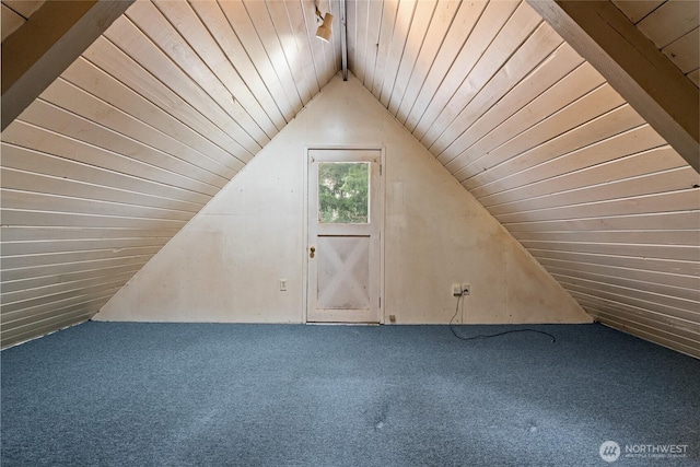 bonus room with lofted ceiling with beams, wooden ceiling, and carpet flooring