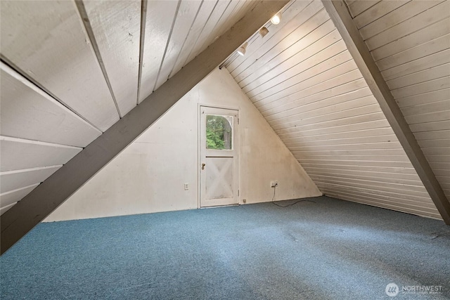 bonus room with lofted ceiling with beams, carpet, and wood ceiling