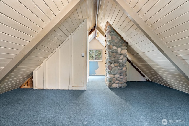 additional living space with lofted ceiling with beams, carpet flooring, and wooden ceiling