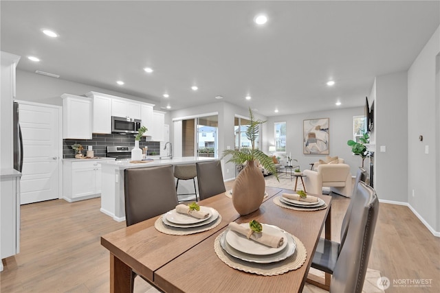 32898 Pine Ave SE, Black Diamond, WA 98010 - dining space featuring recessed lighting, light wood finished floors, and baseboards