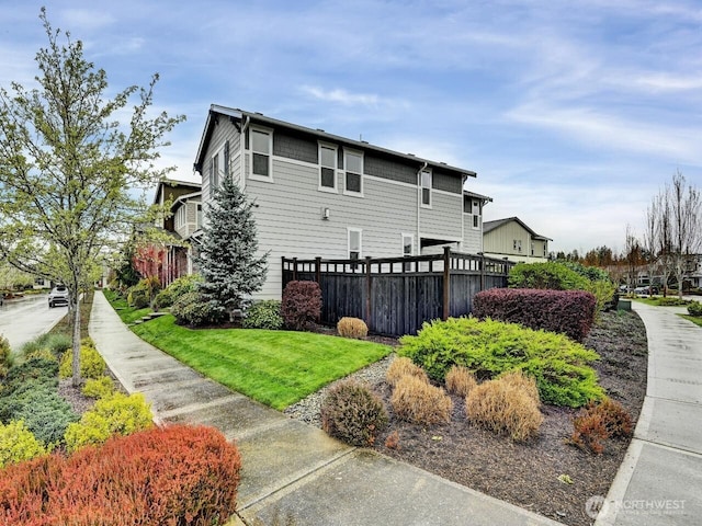 32898 Pine Ave SE, Black Diamond, WA 98010 - view of side of home featuring fence and a lawn