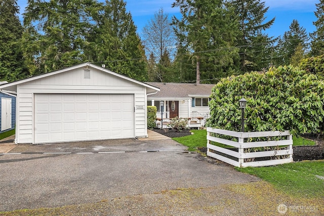 view of front of property with a detached garage