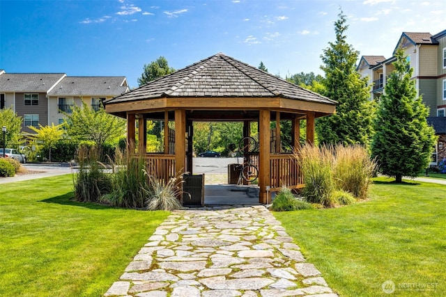 surrounding community featuring a gazebo and a yard