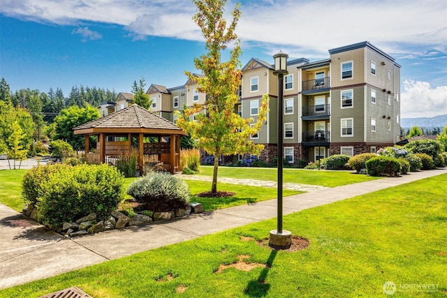 view of community with a gazebo and a yard