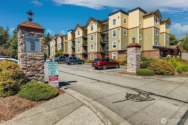 exterior space with a residential view and uncovered parking