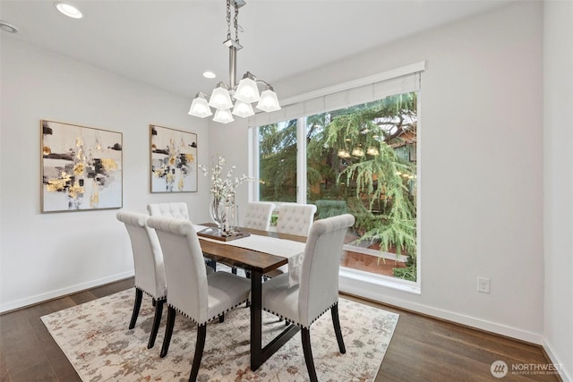 dining area featuring a notable chandelier, recessed lighting, baseboards, and wood finished floors