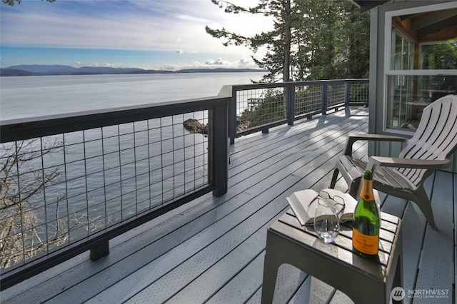 wooden terrace with a water view
