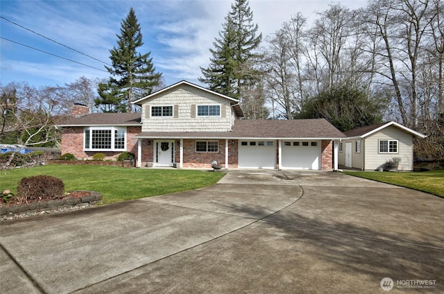 view of front of home featuring a front yard, driveway, an attached garage, a chimney, and brick siding