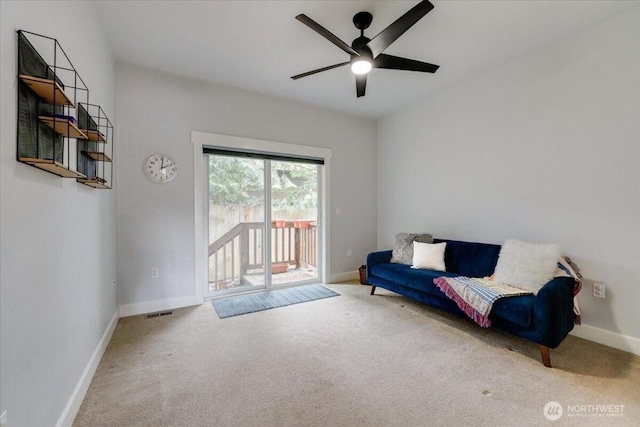 sitting room with visible vents, baseboards, ceiling fan, and carpet flooring