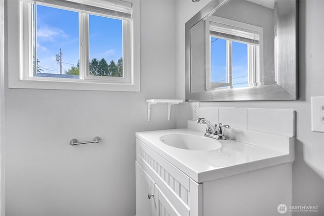 bathroom with vanity and a wealth of natural light