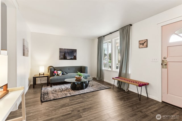 living room featuring wood finished floors and baseboards