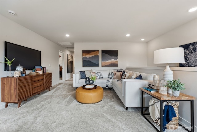 carpeted living room with recessed lighting and visible vents