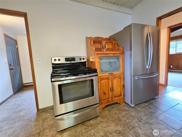 kitchen with stainless steel appliances, baseboards, brown cabinetry, and a baseboard radiator