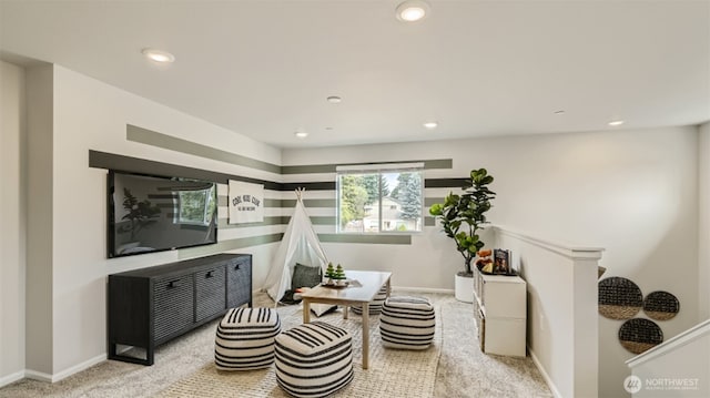 living area with recessed lighting, baseboards, and carpet flooring