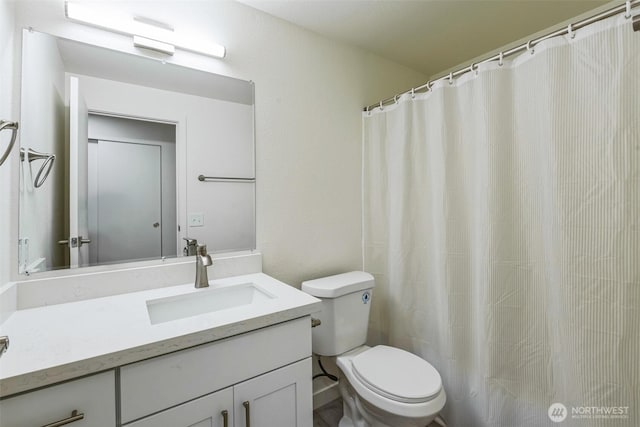 full bath featuring toilet and vanity