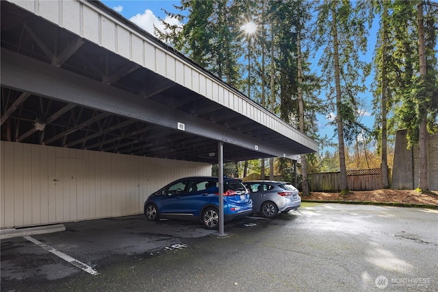 covered parking lot with fence