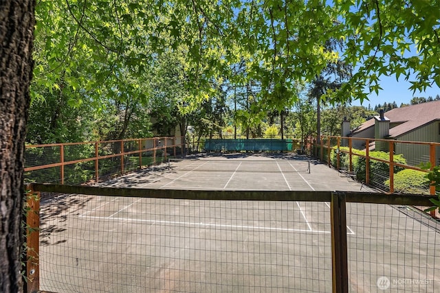 view of sport court with fence