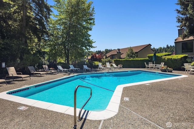 community pool with a patio