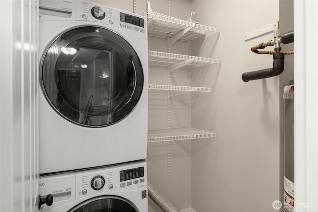 washroom featuring laundry area and stacked washer and clothes dryer