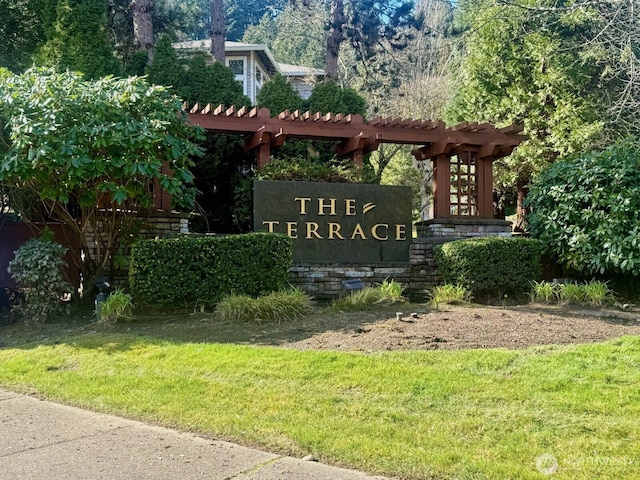 community / neighborhood sign with a lawn