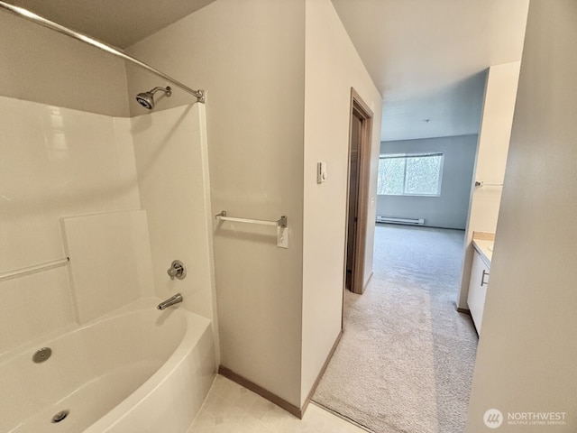 bathroom with a baseboard heating unit, vanity, tub / shower combination, and baseboards