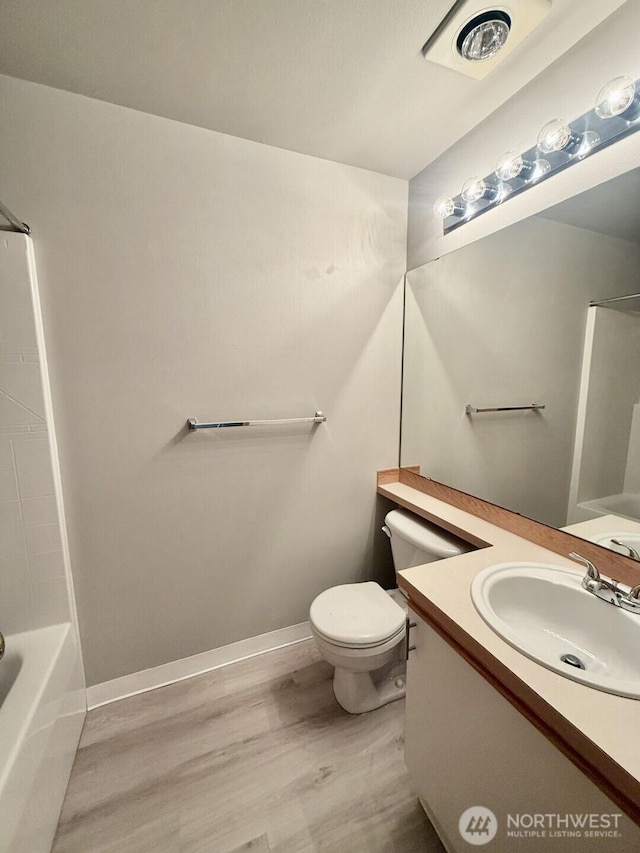 22212 42nd Ave S Unit 204, Kent, WA 98032 - bathroom with wood finished floors, vanity, and bathtub / shower combination