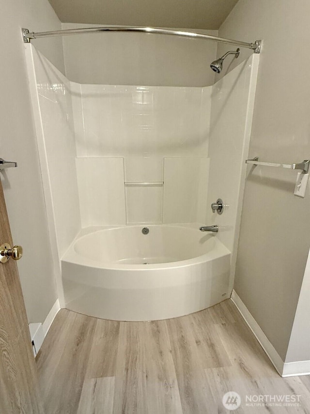 22212 42nd Ave S Unit 204, Kent, WA 98032 - full bathroom featuring wood finished floors and shower / tub combination