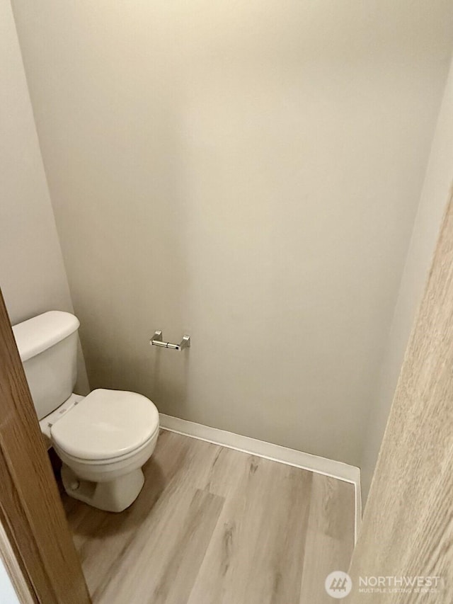 22212 42nd Ave S Unit 204, Kent, WA 98032 - bathroom with wood finished floors and toilet