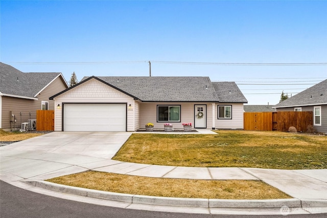 ranch-style house with a front lawn, driveway, fence, a shingled roof, and a garage