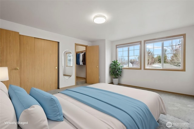 bedroom with baseboards and carpet floors