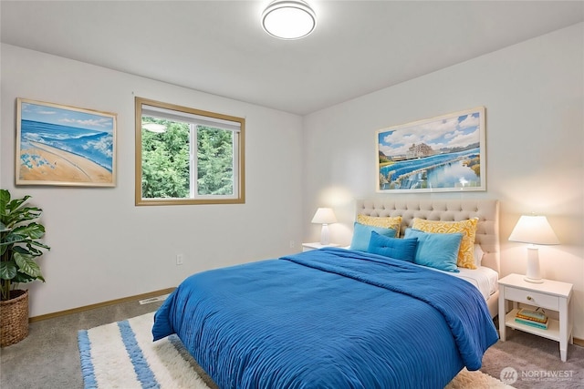 bedroom with baseboards and carpet floors