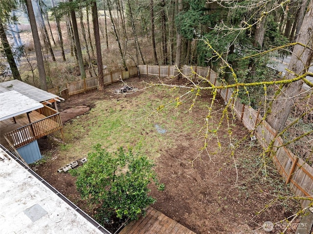 view of yard featuring a fenced backyard and a wooden deck