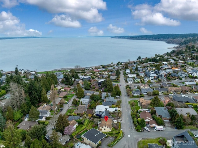 birds eye view of property with a residential view and a water view