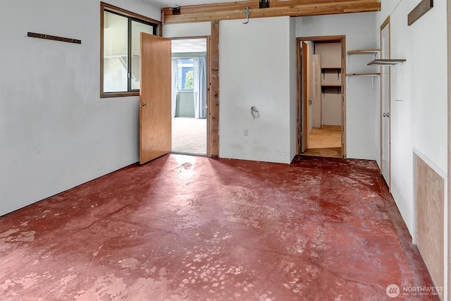 spare room with concrete flooring