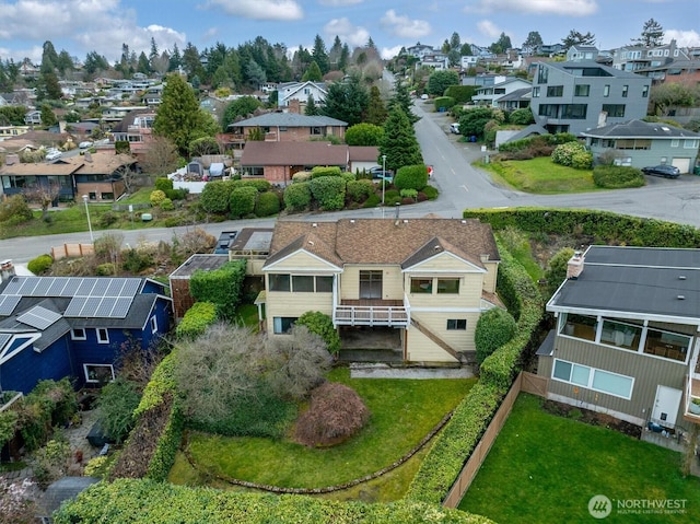 birds eye view of property with a residential view