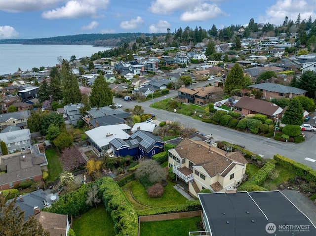 bird's eye view with a residential view and a water view