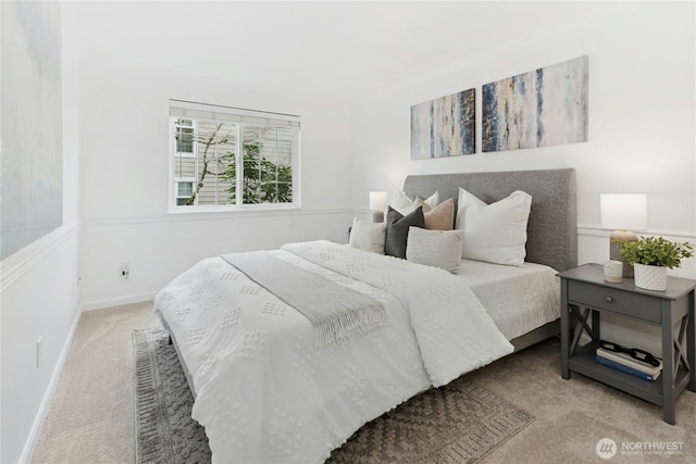 carpeted bedroom featuring baseboards