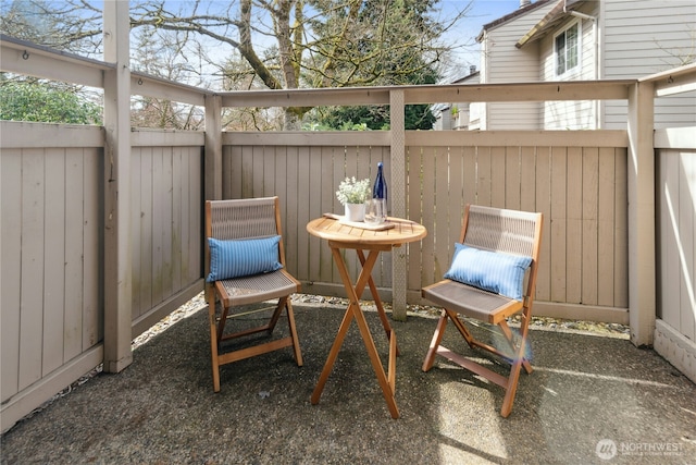 view of patio featuring fence