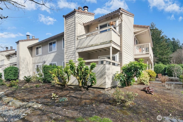 view of side of property with a chimney