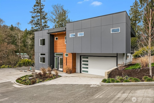 modern home featuring a garage and driveway